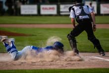 Ty Trometer slides head first safely into home to score a run for the Huskies against Beresford/ Alcester-Hudson May 17. Photo by Peterman Sports Photography • stevepeterman5@gmail.com