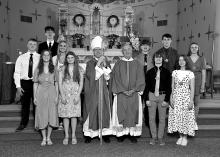 Students of St. Joseph’s and St. Peter’s Catholic Churches received Confirmation April 22. Pictured are, front from left, Isabelle Connors, Samantha Marx, Bishop Donald DeGrood, Father Joseph Vogel, Gunnar Swanson and Hazel Ritchie; and back, Ruben (RJ) Chicoine, Aaron Coyle, Elise Fornia, Wyatt Herrity, Nicholas Schmitz and Jillyan VandeVegte. Photo by Peterman Photography