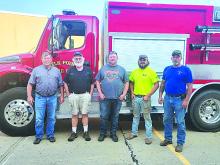 The Elk Point Volunteer Fire Department (EPVFD) donated $25,000 to the Elk Point Fire Protection District (EPFPD) to help pay for a new 3,000 gallon tanker. Pictured are, from left, Brian McInerney (EPFPD President), Jerry Kyte (EPFPD Secretary/Treasurer), Daniel Herrity (EPVFD Assistant Fire Chief ), Andrew Teply (EPVFD newly-certified state firefighter) and Don Klunder (EPVFD Fire Chief). Submitted photo