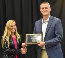Jason Kleis accepts a plaque naming him as the Boys Basketball Coach of the Year from the South Dakota High School Coaches Association June 18. Photo by Peterman Sports Photography • stevepeterman5@gmail.com