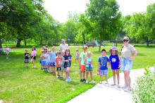 Jackson Kasprzak and Maddi Kallsen pose with campers on June 21. Kasprzak and Kallsen are naturalist interns at the Adams Homestead and Nature Preserve. Photos by Kelly Riibe • times2reporter@gmail.com