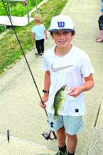  Jack was the first one to catch a fish at the annual fishing derby. He caught a 13 inch large mouth bass. (Left) The McCook Lake Izaak Walton League held their annual Youth Fishing Derby Saturday, June 17. Submitted photos