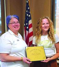 Elk Point VFW Auxiliary President Sarah Dosdall presents Maggie Breyfogle with a certificate for her first place artwork from the South Dakota VFW Auxiliary Young American Creative Patriotic Art Contest. Breyfogle now advances into the national contest. Submitted photo