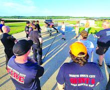 Emergency responders learn how to stabilize an aircraft and access the cockpit in case of emergencies. They also learned onsite hazards at Graham Airfield and an overview of general aviation aircraft terminology. Different fuel types were discussed and how to handle fuel leaks or spills. Submitted photos