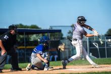Jaxon Hennies gets a hit against Elk Point-Jefferson. Photo by Peterman Sports Photography • stevepeterman5@gmail.com