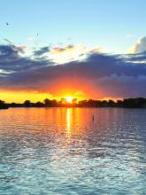 A glorious orange sunset could be seen across the area on Saturday, June 24. This photo was captured as the sun set behind McCook Lake. Photo courtesy of Julie Burhoop