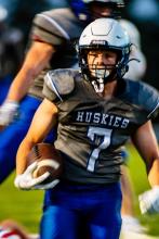 Gunner Ewing gets a touchdown for the Huskies after a 15-yard run.