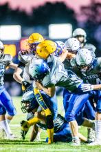 Beau Schmitz gets in on the tackle against Baltic Aug. 25. Photo by Peterman Sports Photography stevepeterman5@gmail.com