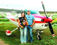 Christy Heckathorn his pictured with her husband, Chad, in front of their plane. A unique aspect of Fleurish Flower Farm is that there is a grass runway for planes at the back of the property. Photos courtesy of Christy Heckathorn