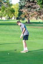 Eli Connors sinks a putt during the Husky Invite Sept. 14. Photo by Peterman Sports Photography stevepeterman5@gmail.com