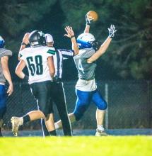 Evan Fornia intercepted the ball and ran it back to the Huskies endzone for a pick-six during the Homecoming game Sept. 15. Photo by Peterman Sports Photography stevepeterman5@gmail.com