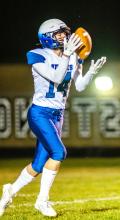 Grayson Girard catches the ball on a kickoff. Photo by Peterman Sports Photography • stevepeterman5@gmail.com