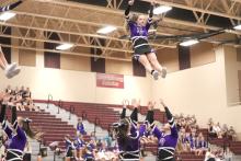 Sophomore Bailey Link is a flyer on the Dakota Valley Competition Cheer team. She’s shown getting tossed in the air at the Harrisburg Invite. Submitted photo