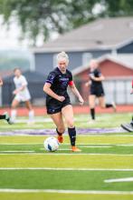 Ashlynn Stusse brings the ball up the field toward the goal. Photo by Peterman Sports Photography stevepeterman5@gmail.com