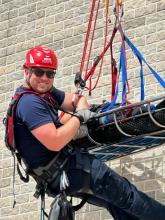 Tyler Kruse practices his rope rescue techniques to safely rappel to a patient in need and bring them back up to other awaiting emergency service providers. Submitted photo
