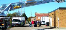 Emergency personnel responded to a rooftop accident in Elk Point Monday, Oct. 23. Shown here is the overwhelming response of mainly local volunteer responders from Elk Point and North Sioux City. The individual was safely removed from the roof and is being carefully lifted from a rescue basket onto a stretcher to be taken by ambulance to a helicopter for transport to an area hospital.  Photo by Beth Hutcheson • times1reporter@gmail.com