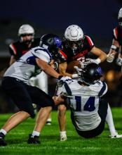 Brayden Stivers and Trae Piel go in for the tackle. Photo by Peterman Sports Photography stevepeterman5@gmail.com