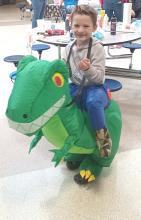 This boy and his dinosaur enjoy a treat from the Elk Point Library’s pumpkin painting event Oct. 28. Submitted photos