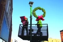 The 2023 Christmas season officially kicked off with the City of Elk Point’s annual decorating of the Main Street light poles. City employees put up the decorations on Wednesday, Nov. 23. Photo by Beth Hutcheson• times1reporter@gmail.com