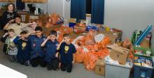 Elk Point-Jefferson Cub Scout Pack 87 dropped off food to the Elk Point Food Pantry. The food was collected from their Scouting for Food event held Nov. 1-12. Pictured above is Food Pantry Director Tam Edgar, the cub scouts and their donation of food. Submitted photo