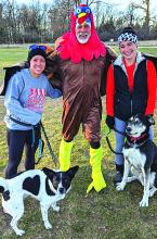 Phil Breed, middle, was ready for the Turkey Trot held at Adams Homestead and Nature Preserve Nov. 23. Pictured with Breed are, left, Rheanne Hoffman with her dog, Sadie, and, right, Courtney Leaverton with her dog, Luke. Submitted photo