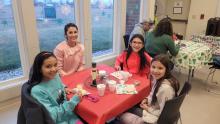 Demi Harlan, of Wynstone, and her three daughters enjoyed decorating cookies at the NSC Library on Dec. 14. Pictured are, clockwise starting with mom, Demi Harlan, Alexis Harlan, Aubrie Harlan and Audrina Harlan. Photo by Kelly Riibe • times2reporter@gmail.com