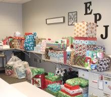 Area churches dropped off Christmas present donations to the Elk Point-Jefferson School District as a part of the Husky Angel Tree. This is just a small portion of the presents that filled the Administrative Office Dec. 12. Photo by Beth Hutcheson • times1reporter@gmail.com