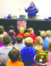 The Elk Point-Jefferson elementary students were provided the opportunity from The Great Plains Zoo’s Zoomobile to learn about four animals on Thursday, Dec. 7. The Junior Kindergarten and Kindergarten students, pictured here, learned about a snake, Madagascar Hissing Cockroaches, a leopard gecko and a tortoise. The classes learned about the movements of the animals and insects and the different habitats they live in. Photo by Beth Hutcheson • times1reporter@ gmail.com