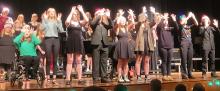The senior choir students did sign language while performing “Stille Nacht” at the holiday concert on Dec. 1. The seniors, from left, are Karlee Hughes, Madisen Bell, Stella Carlson, Kaleb Haiar, Grace Powell, Madisen Grooms, Qiara Bruguier, Ollie Hermes and Lewis Pick. Submitted photo