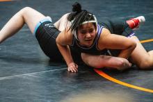 Anna Lee looks for the signal from the ref as she pins down her opponent in Canton. Photo by Peterman Sports Photography • stevepeterman5@gmail.com