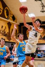 Luke Bruns goes in for a lay-up Jan. 20. Photo by Peterman Sports Photography stevepeterman5@gmail.com