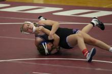 McKenzie Scott looks for the pin in the DAK-XII Conference Wrestling Tournament Jan. 20. She finished 2nd place in the girls 120lb bracket. Submitted photo