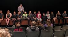 Dakota Valley One Act students performed their comedy production, “The Best Play Ever, Guaranteed” on Friday, Jan. 19 and Saturday, Jan. 20. After each performance, the students sat on the stage and did a ten minute Q&amp;A with the audience. Director/Advisor Anne Michaelson stands behind her students as they talk with members of the audience. Photo by Kelly Riibe • times2reporter@gmail.com