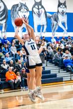 Grace Peed goes up for the jump shot against West Central Jan. 2. She scored 6 points during the game. Photo by Peterman Sports Photography stevepeterman5@gmail.com
