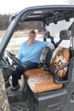 Char Campbell of rural Elk Point has opened her business Artsy Fartsy and enjoys the challenge of upholstery. Recently she reupholstered her ATV with cowhide seats. Photo by Beth Hutcheson • times1reporter@gmail.com