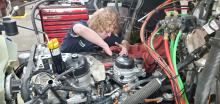 Elk Point-Jefferson senior Johnathan Kjose works on replacing the oil in a semi-tractor. Submitted photo