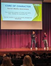 Mark Leinweaver on stage in the Performing Arts Center with Dakota Valley student Ryder Smith on Feb. 9. Smith was the first student to volunteer to help Leinweaver on stage as the speaker discussed social media awareness and anti-bullying. Photo by Kelly Riibe • times2reporter@gmail.com