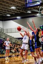 Sophie Tuttle goes up against two Elk Point-Jefferson defenders on Feb. 1. Tuttle scored 7 points for the Panthers. Photo by Peterman Sports Photography • stevepeterman5@gmail.com