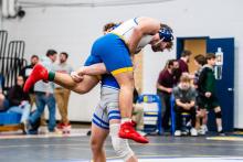 Gunner Ewing picks up Lucas Gonzalez of Garretson. Ewing won the match with a pin in 3:05 in the region tournament. Ewing took 4th to advance to state. Photo by Peterman Sports Photography • stevepeterman5@gmail.com