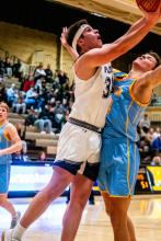 Jaxson Wingert pushes his way to the basket to score against Hamlin at the Mitchell Corn Palace Jan. 20. Photo by Peterman Sports Photography stevepeterman5@gmail.com