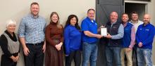 The North Sioux City Economic Development Corporation’s March Business of the Month award was presented to ECI. Pictured are, from left, NSCEDC Director Kathy Gunderson, NSCEDC Executive Director Andrew Nilges, NSCEDC Director Megan Moore, ECI Business &amp; Brand Development Megan Jackson, Tyler Solma, NSCEDC Board President Mike Huber and NSCEDC Directors Jamie Wankum, Kevin Heiss and John Stevens. Submitted photo