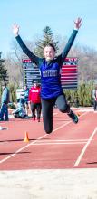 Sophomore Claire Munch won the triple jump and broke the DV school record in the process at Homer April 11. Munch jumped 36’8” to eclipse the previous record held by Anna Rasmussen. She’s pictured here at the Vermillion meet. Photo by Peterman Sports Photography • stevepeterman5@gmail.com