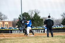 Drew Lukken is called safe at first base on March 29 against Baltic.  Photos by Peterman Sports Photography • stevepeterman5@gmail.com