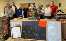 North Sioux City Economic Development Corporations (NSCEDC) named Chef Al’s as the April Business of the Month award. Pictured are, from left, NSCEDC Directors Kevin Heiss, Greg Hoffman, John Stevens, Jamie Wankum and Kathy Gunderson, Owner James Alger, Makara Alger, Colter DeNoble, NSCEDC Board President Mike Huber and NSCEDC Executive Director Andrew Nilges Submitted photo