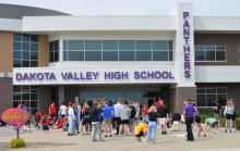 On May 10, graduating seniors at Dakota Valley used chalk to draw college decals of their school choices for next fall. The chalk art gathering is an annual event for seniors and occured in front of the DV high school. Photos by Kelly Riibe • times2reporter@gmail.com