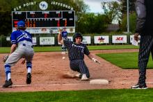 Brendan Barnett slides safely into 3rd during the Panther win over the Huskies. Photo by Peterman Sports Photography • stevepeterman5@gmail.com