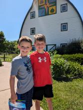 From left Jamison Moore and Ty Ledgerwood, both of Elk Point, traveled to North Sioux City for summer camp at the Adams Homestead & Nature Preserve on June 11-13. They are seen here outside of the visitor center after a full morning of activities.     Photo by Kelly Riibe • times2reporter@gmail.com