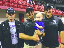 Four generations of VanDenHuls took in DV’s championship football game at the DakotaDome in 2017. Jeff and his son Josh were on the sidelines while Jeff’s dad (George) and grandson (Theo) were in the crowd. From left: Jeff’s dad, George VanDenHul, son Josh who was an assistant coach, grandson Theo, and Jeff at the Championship game in Vermillion.
