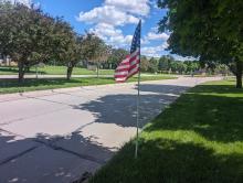 American flags lined Dakota Dunes Boulevard on Monday, May 27, in honor of Memorial Day. The flags began at the start of the residential entrance area leading to the Prairie and the Meadows and extended into the Country Club neighborhood. It was a beautiful site. See more Memorial Day photos on page 10. Photo by Kelly Riibe • times2reporter@gmail.com