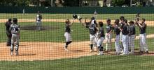Dakota Valley’s Noah Graham is greeted by teammates after his solo homerun on Friday, June 7th. Submitted photo